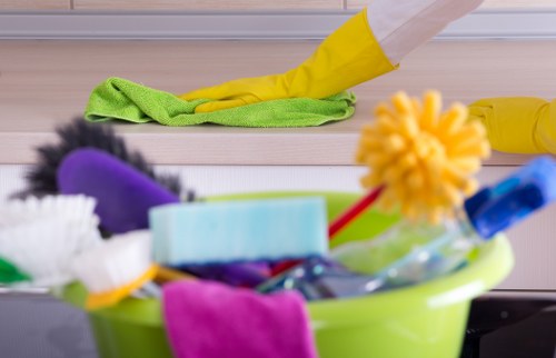 Professional cleaners sanitising desks and high-touch points in a Pimlico office